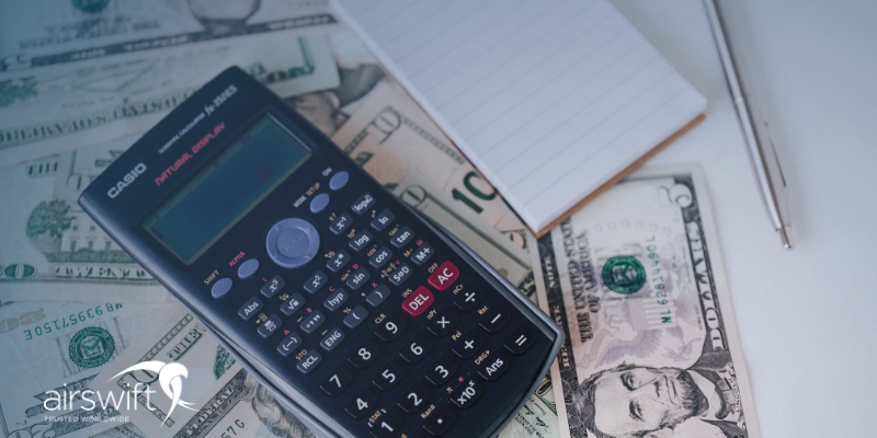 Calculator and money on top of a table